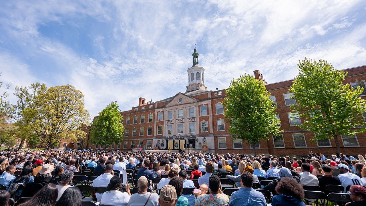 Students, faculty, staff and guest fill the oval in front of Erskine Hall for Commencement.