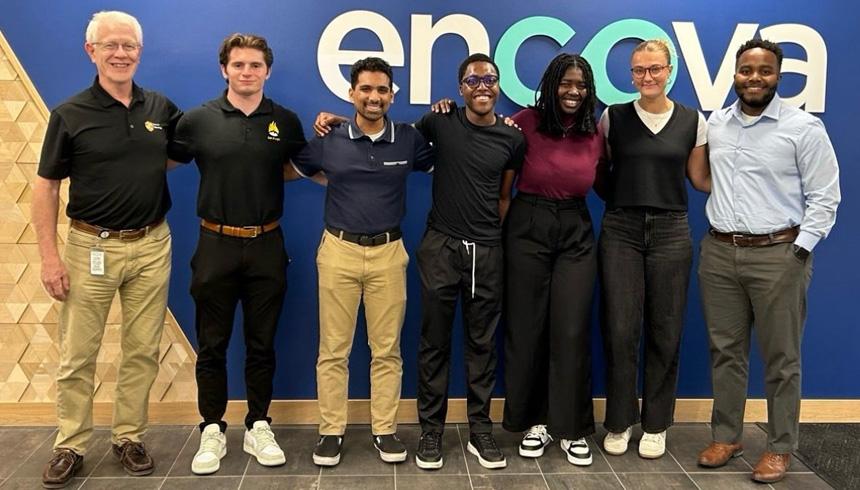Students who interned at Encova stand with the staff at IRMA.