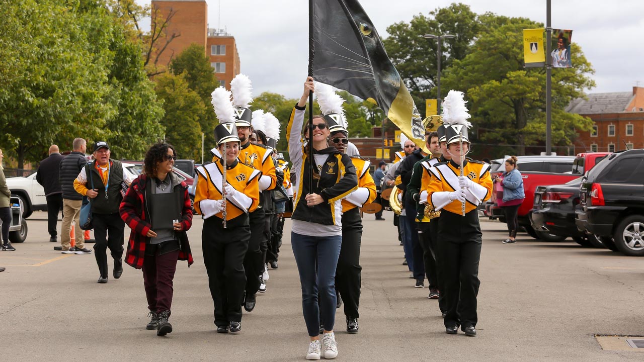 Members of the ODU band march to Panther Stadium.