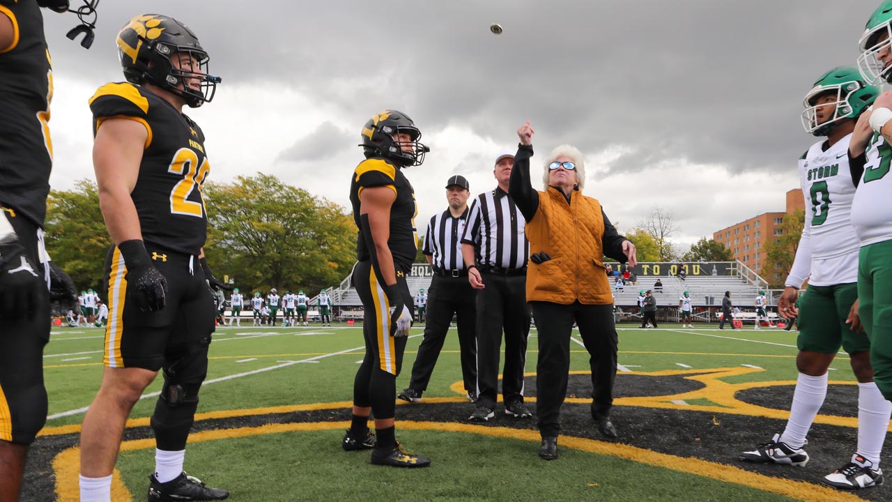 ODU President Gallaher performs the official coin toss to kick off the game.