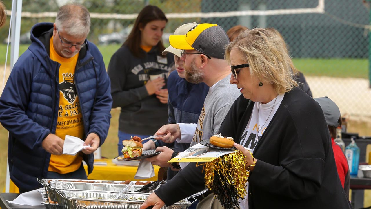 Members of the ODU community gather at the pre-game tailgate.