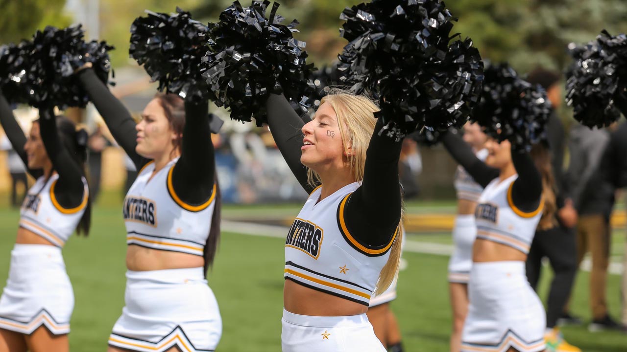 ODU cheerleaders lead the stadium in cheering on the Panthers.