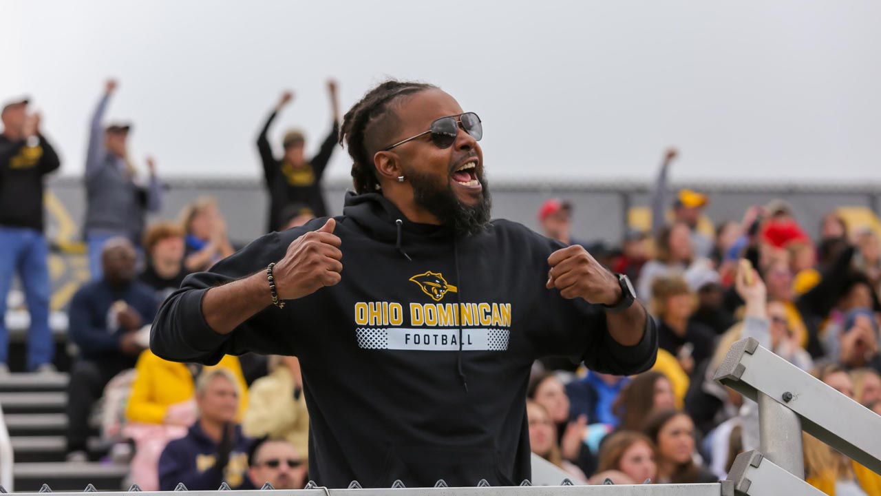 ODU fan cheers on the Panthers from the stadium.