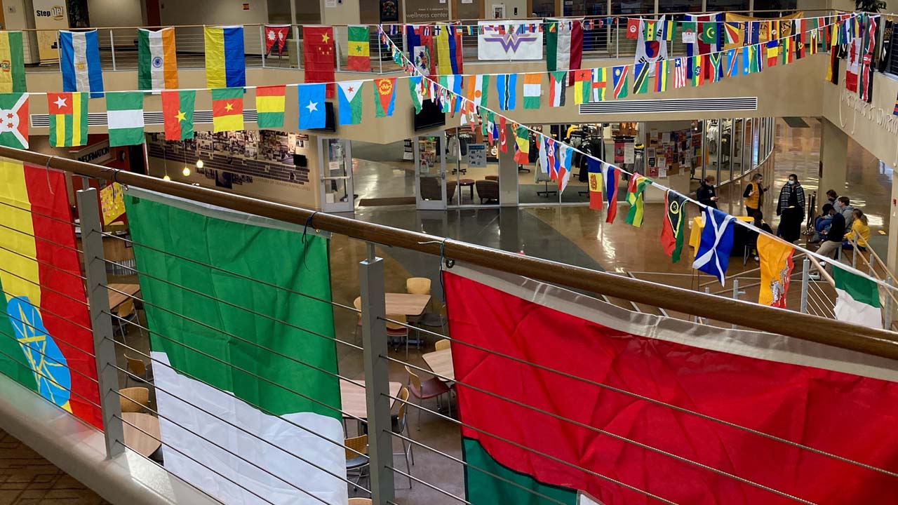 A view of the food court in the Griffin Student Center, fully decorated with flags from around the world for IEW.