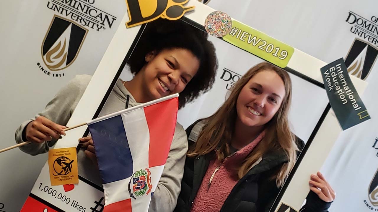 Panthers take a photo with the selfie frame during IEW 2019.